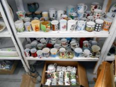 A good lot of mugs on 3 shelves, including Portmeirion, Tigger, Winnie The Pooh, animals, sport,