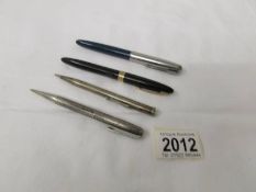 A silver propelling pencil (25 grams), a Yard of Lead propelling pencil,