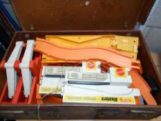 An old suitcase containing Mattel hot wheels track (no cars)