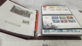 An album of assorted first day covers.
