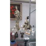 A selection of oriental figures including porcelain, tall resin figure etc.