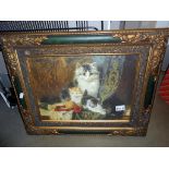An antique effect framed print of cats 56cm x 46cm