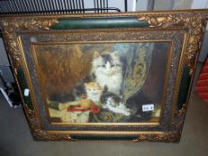 An antique effect framed print of cats 56cm x 46cm