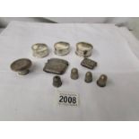 A mixed lot of silver items including 3 silver napkin rings, 4 thimbles, a vesta etc.