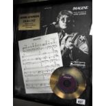 A framed limited edition John Lennon Imagine 24kt gold plated record 1131/2500 (in need of a clean)