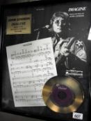 A framed limited edition John Lennon Imagine 24kt gold plated record 1131/2500 (in need of a clean)