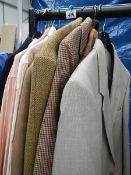 A mixed lot of men's clothing including Lacoste shirts, men's blazers etc.
