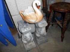 2 stone garden bench pillars (missing seat) plus a pottery swan planter