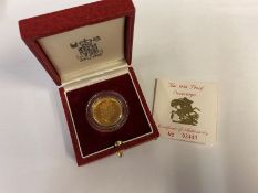 A 1986 gold sovereign (the coin has been handled)