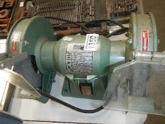 An old bench grinder (plastic guard a/f).