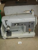 A Singer electric sewing machine.