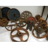 A good selection of cast wheels and pulleys.