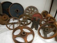 A good selection of cast wheels and pulleys.