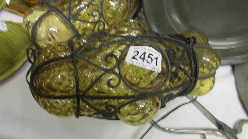 A pair of wrought iron and amber coloured glass porch lanterns. - Image 2 of 2