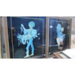 A pair of prints of a boy and girl on glass.