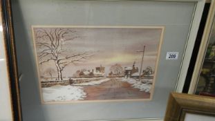 A framed and glazed water colour village scene.