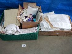 A box of vintage haberdashery and a box of vintage items including 2 early 20th century gowns,