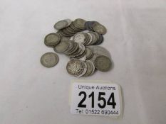 Approximately 40 silver threepenny bits, approximately 57 grams.