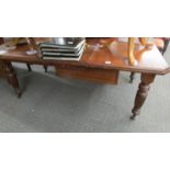 An early 20th century mahogany extending dining table.