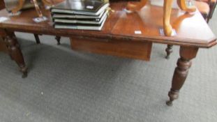 An early 20th century mahogany extending dining table.