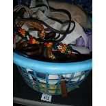 A basket of scarves, belts etc.