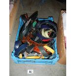 A box of assorted belts.