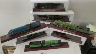 5 boxed and 3 unboxed ornamental model locomotives.