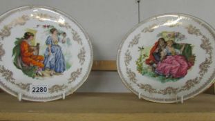 A pair of hand painted Gainsborough porcelain cabinet plates signed V Hunnike.