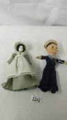 A vintage cloth sailor doll and a small doll.