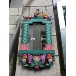 A painted framed mirror decorated with fruit 71cm x 37cm