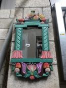 A painted framed mirror decorated with fruit 71cm x 37cm