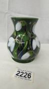 An Anita Harris Studio Pottery Trojan vase in Snowdrop design,10 cm tall, signed in gold to base.