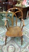 A 19th century oak country chair with hoop stretcher.