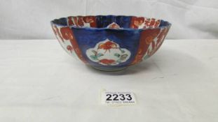 A Chinese bowl, 18 cm diameter, chip to rim.