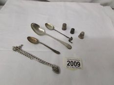 3 silver spoons, 3 silver thimbles and a silver chain, approximately 65 grams.