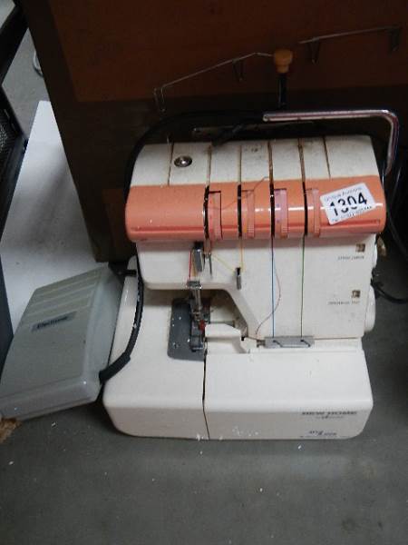 An old electric overlocker sewing machine.