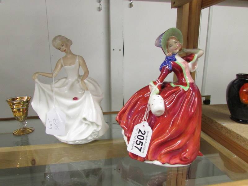 2 Royal Doulton figurines 'Tracy' Hn2736 and Autumn Breezes HN 1934.