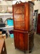 a dark wood corner cupboard with glazed top door and cupboard door, Height 185cm, width 67cm,