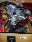 A quantity of silk and other scarves.
