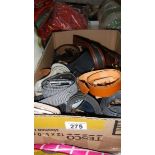 A box of assorted belts.
