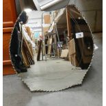 A horse shoe shaped bevel edged mirror in good condition, 46 x 47 cm.