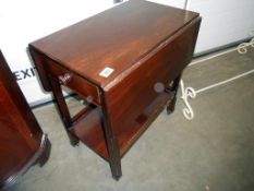 An Edwardian mahogany drop leaf tea trolley