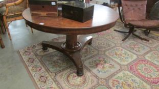 A Victorian mahogany circular centre pedestal table.