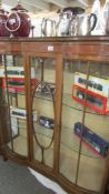 An Edwardian mahogany inlaid display cabinet.