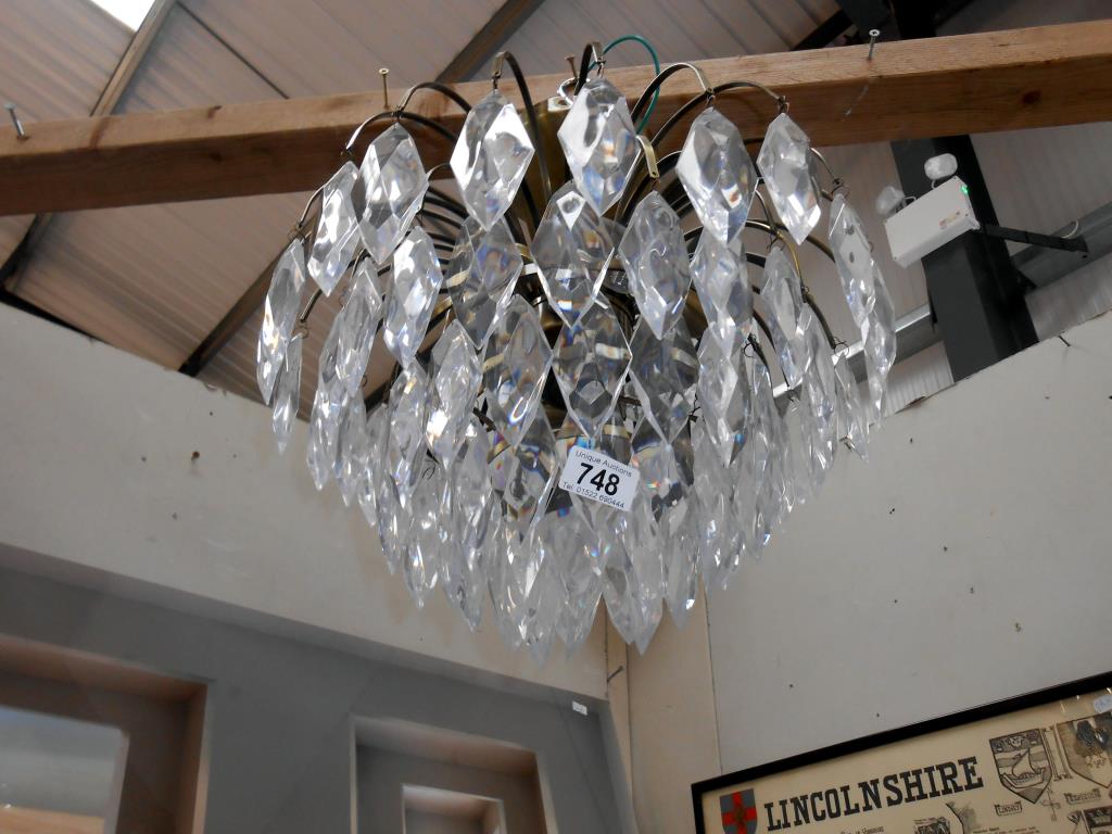 A reproduction chandelier with antique brass frame and acrylic droppers - Image 2 of 2