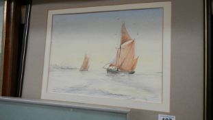 A framed and glazed watercolour of sailing boats.