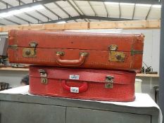2 vintage suitcases.