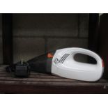 A portable hand held Vax vacuum cleaner,