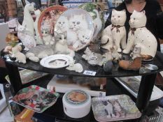 A quantity of cat related items, including figures, trays, coasters,