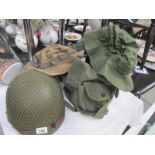 A US military helmet purportedly used in Vietnam and 2 hats and holdall